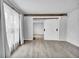Stylish bonus room featuring wood-look floors and sliding barn doors at 6680 E Rustic Dr, Parker, CO 80138