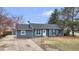 Cozy single-story home with updated siding, landscaping, and a well-manicured front yard at 6680 E Rustic Dr, Parker, CO 80138
