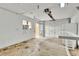A spacious garage with an automatic door, window, and access door that leads to the outside at 6680 E Rustic Dr, Parker, CO 80138