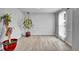 Spacious living room with lots of natural light, wood-look floors, and neutral paint at 6680 E Rustic Dr, Parker, CO 80138