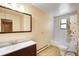 Bathroom featuring tile flooring, a shower-tub combination, and neutral colors at 33090 Janelle Cir, Golden, CO 80403