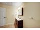 Bathroom featuring tile flooring, a vanity sink, and a mirror at 33090 Janelle Cir, Golden, CO 80403