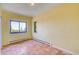 Bedroom with yellow walls and large windows allowing for ample natural light at 33090 Janelle Cir, Golden, CO 80403