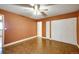 Bedroom featuring a ceiling fan, double closets, and ample natural light at 33090 Janelle Cir, Golden, CO 80403