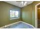Bedroom featuring green walls and a large window view at 33090 Janelle Cir, Golden, CO 80403
