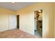 Bedroom featuring yellow walls with closet and bonus room access at 33090 Janelle Cir, Golden, CO 80403