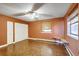 Cozy bedroom featuring a built-in desk, ceiling fan, and ample natural light at 33090 Janelle Cir, Golden, CO 80403