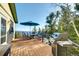 Spacious outdoor deck with stainless steel grill, seating, and an umbrella with stunning mountain views at 33090 Janelle Cir, Golden, CO 80403