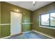 Entryway features a green accent wall and a large window view at 33090 Janelle Cir, Golden, CO 80403