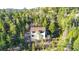 Mountain home with a deck, blending into the surrounding lush trees, offering tranquility at 33090 Janelle Cir, Golden, CO 80403