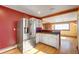 Stainless steel fridge in eat-in kitchen featuring an open plan to the dining and living areas at 33090 Janelle Cir, Golden, CO 80403