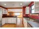 The kitchen has a stainless steel dishwasher, sink, and a view into the dining and living areas at 33090 Janelle Cir, Golden, CO 80403