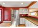Kitchen features stainless steel refrigerator, and views to the dining and living areas at 33090 Janelle Cir, Golden, CO 80403