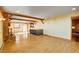 Open-concept living room featuring hardwood floors, fireplace, and easy access to the kitchen and dining areas at 33090 Janelle Cir, Golden, CO 80403