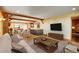 Inviting living room features exposed beams, hardwood floors, and modern decor at 33090 Janelle Cir, Golden, CO 80403