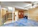 Living room with blue flooring, staircase, and built in storage at 33090 Janelle Cir, Golden, CO 80403