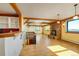 Bright, open living room with hardwood floors and a view of the fireplace at 33090 Janelle Cir, Golden, CO 80403