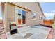 Backyard with patio, grill, and sliding glass door at 12513 Grape St, Thornton, CO 80241