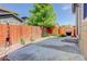 A spacious backyard patio area with a wooden fence, offering privacy and space at 12513 Grape St, Thornton, CO 80241