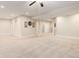 Spacious finished basement with carpeted floors and neutral-painted walls at 12513 Grape St, Thornton, CO 80241
