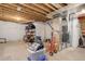 Unfinished basement with exposed ceiling, open space, and utilities at 12513 Grape St, Thornton, CO 80241