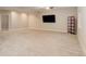 Large finished basement with neutral walls, carpeted floors, and recessed lighting at 12513 Grape St, Thornton, CO 80241