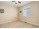 Neutral bedroom features carpeted floors, a ceiling fan, and a window with blinds at 12513 Grape St, Thornton, CO 80241