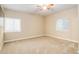 Bedroom with carpeted floors, recessed lighting, and two windows with blinds at 12513 Grape St, Thornton, CO 80241