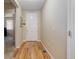 Inviting entryway with wood floors and a white front door at 12513 Grape St, Thornton, CO 80241