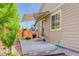 A cozy patio with a retractable awning, perfect for outdoor grilling and relaxation at 12513 Grape St, Thornton, CO 80241
