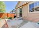 Outdoor patio featuring steps up to sliding glass door and a grill for entertaining at 12513 Grape St, Thornton, CO 80241
