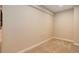 Empty room with beige walls, neutral carpet, and baseboard trim at 12513 Grape St, Thornton, CO 80241