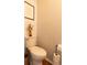 Half-bathroom featuring white-painted wood-paneled walls with an accent picture at 19738 Applewood Ct, Parker, CO 80138