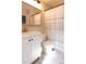 Bright bathroom featuring a white vanity and a shower with a striped curtain at 19738 Applewood Ct, Parker, CO 80138