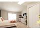 Bright bedroom featuring neutral carpet, a large window, a white bed, and closet with mirrored doors at 19738 Applewood Ct, Parker, CO 80138