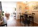 Open concept space shows the dining area next to the living room with hardwood floors at 19738 Applewood Ct, Parker, CO 80138