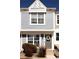 Exterior view of two-story townhouse with gray siding at 19738 Applewood Ct, Parker, CO 80138