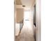 Hallway with neutral carpet and white walls leading to sunlit bedroom at the end of the hall at 19738 Applewood Ct, Parker, CO 80138