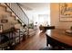 View of open living space with staircase, hardwood floors, and stylish furnishings at 19738 Applewood Ct, Parker, CO 80138
