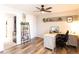 Office space with desk, chair, bookcase, and laundry in distance at 19738 Applewood Ct, Parker, CO 80138