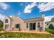 The backyard has a charming patio, a lawn, and mature plantings at 535 High Point Dr, Golden, CO 80403