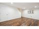 Finished basement with wood-look floors, white walls, and good ceiling height at 535 High Point Dr, Golden, CO 80403