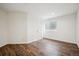 This bedroom features wood-look flooring and a large window at 535 High Point Dr, Golden, CO 80403