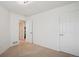 Bedroom highlighting ample closet space and easy access to the hallway and other areas of the home at 535 High Point Dr, Golden, CO 80403