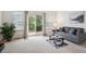 Inviting living room with sliding glass doors opening to a serene outdoor area at 535 High Point Dr, Golden, CO 80403