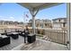 Relaxing outdoor living on this home's elevated deck with comfortable seating and community view at 8733 Arriba Dr, Littleton, CO 80125