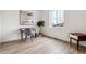 Bright home office with wood floors, desk and large window providing natural light at 8733 Arriba Dr, Littleton, CO 80125