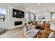 Bright and airy living room with a fireplace, comfortable seating, and modern decor at 8733 Arriba Dr, Littleton, CO 80125