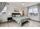 Comfortable main bedroom featuring large window with curtains, ceiling fan and nice decor at 8733 Arriba Dr, Littleton, CO 80125