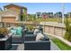 Relaxing outdoor seating area with stylish wicker furniture and plush cushions for cozy gatherings at 8733 Arriba Dr, Littleton, CO 80125